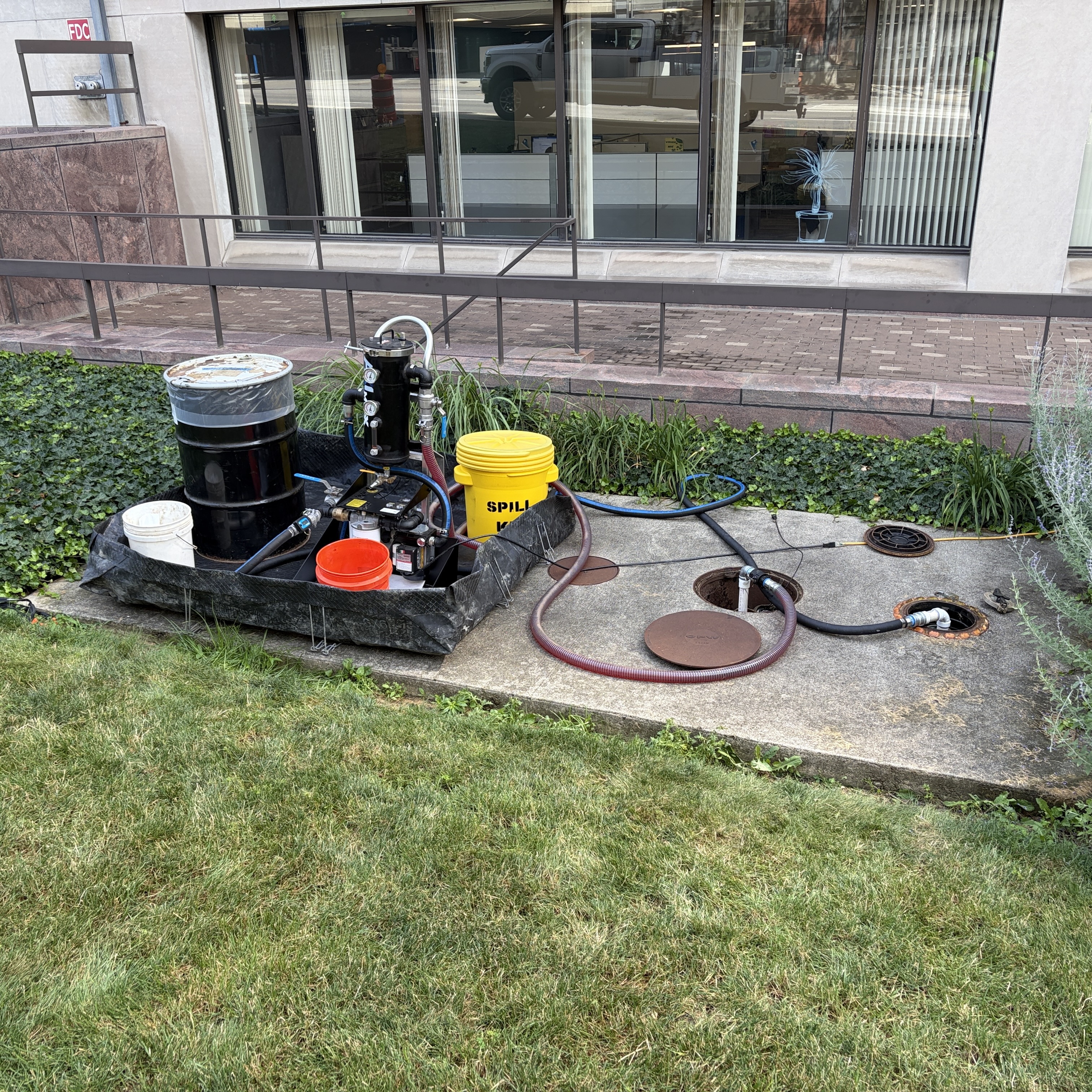 Fuel polishing skid in secondary containment beside open tank access ports